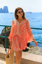 Orange silk luxury kaftan dresses to wear on holiday by Lindsey Brown luxury resort wear 