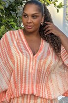 Peach Bloused Drop Waisted silk kaftan dress to wear on vacation by Lindsey Brown luxury silk resort wear