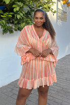 Peach Bloused Drop Waisted silk kaftan dress to wear in the Maldives by Lindsey Brown luxury silk resort wear