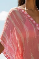 Pink silk designer beach cover ups to wear in the Maldives by Lindsey Brown resort wear 