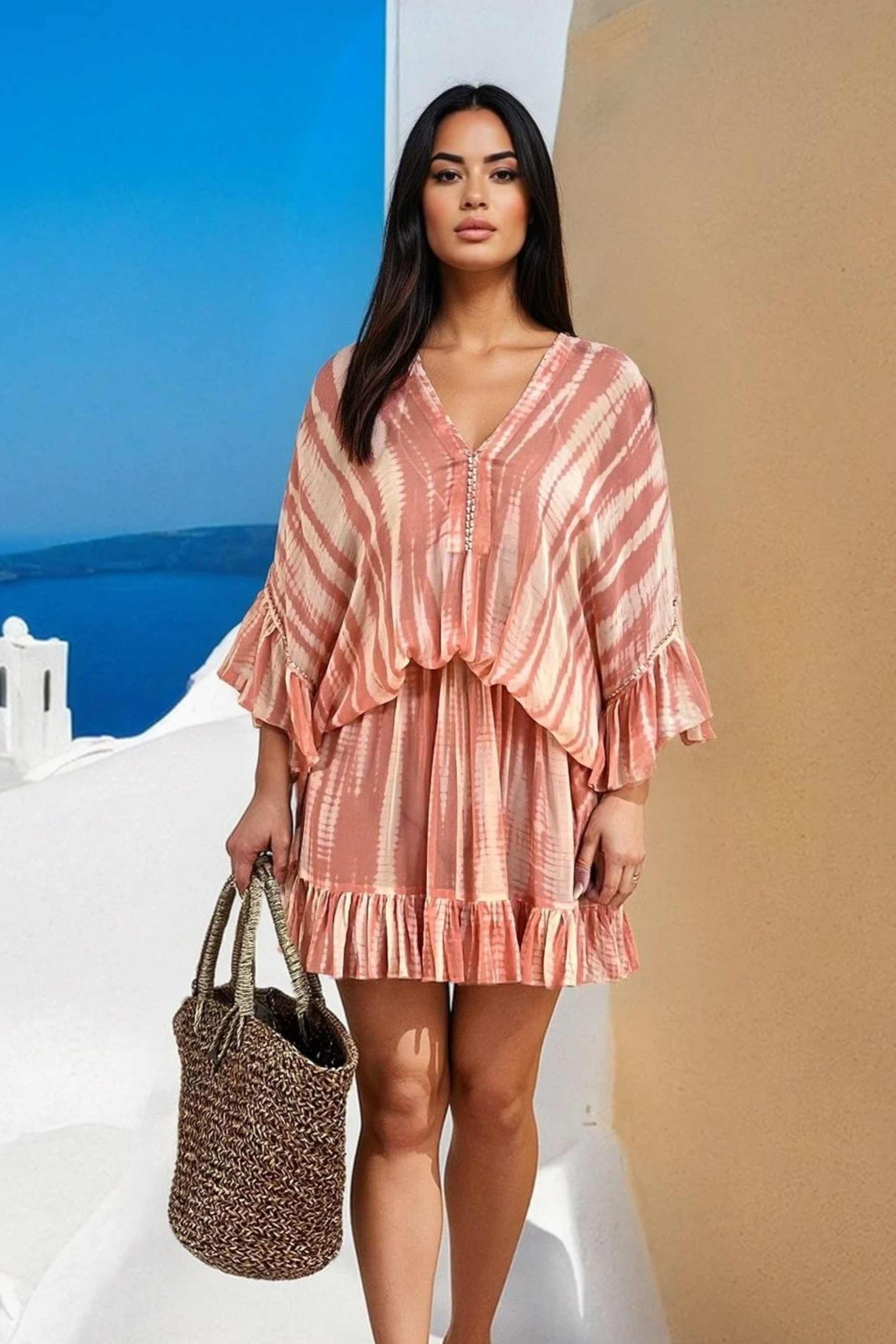 silk blush and ivory  tie dye kaftan dress to wear on holiday by Lindsey brown luxury resort wear 