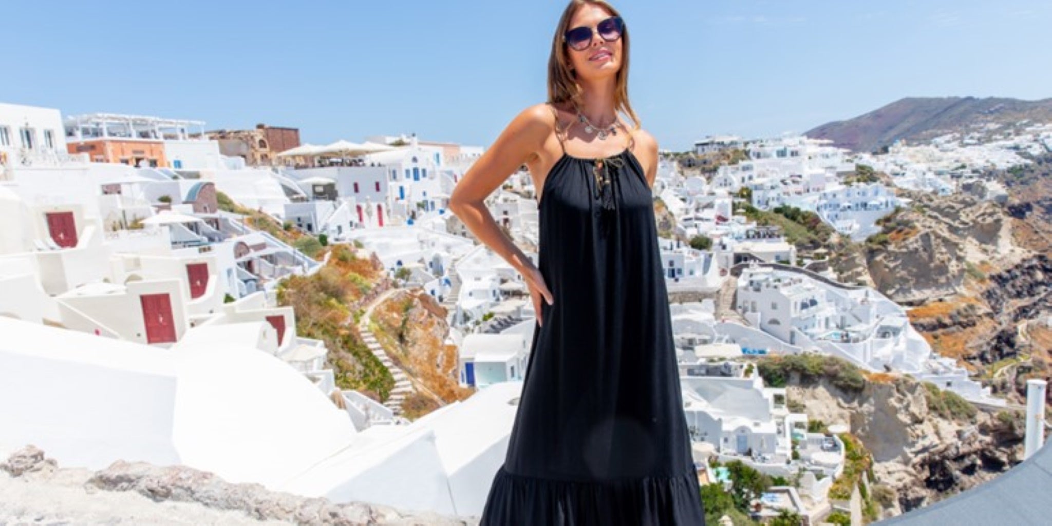 Sleeveless black designer beach dresses by Lindsey Brown luxury resort wear 