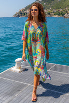 Turquoise Yellow floaty falttering silk designer kaftans to wear on holiday by Lindsey Brown resort wear 