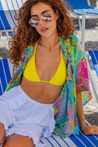 Turquoise printed silk kimono top to wear over swimwear on holiday by Lindsey Brown silk resort wear