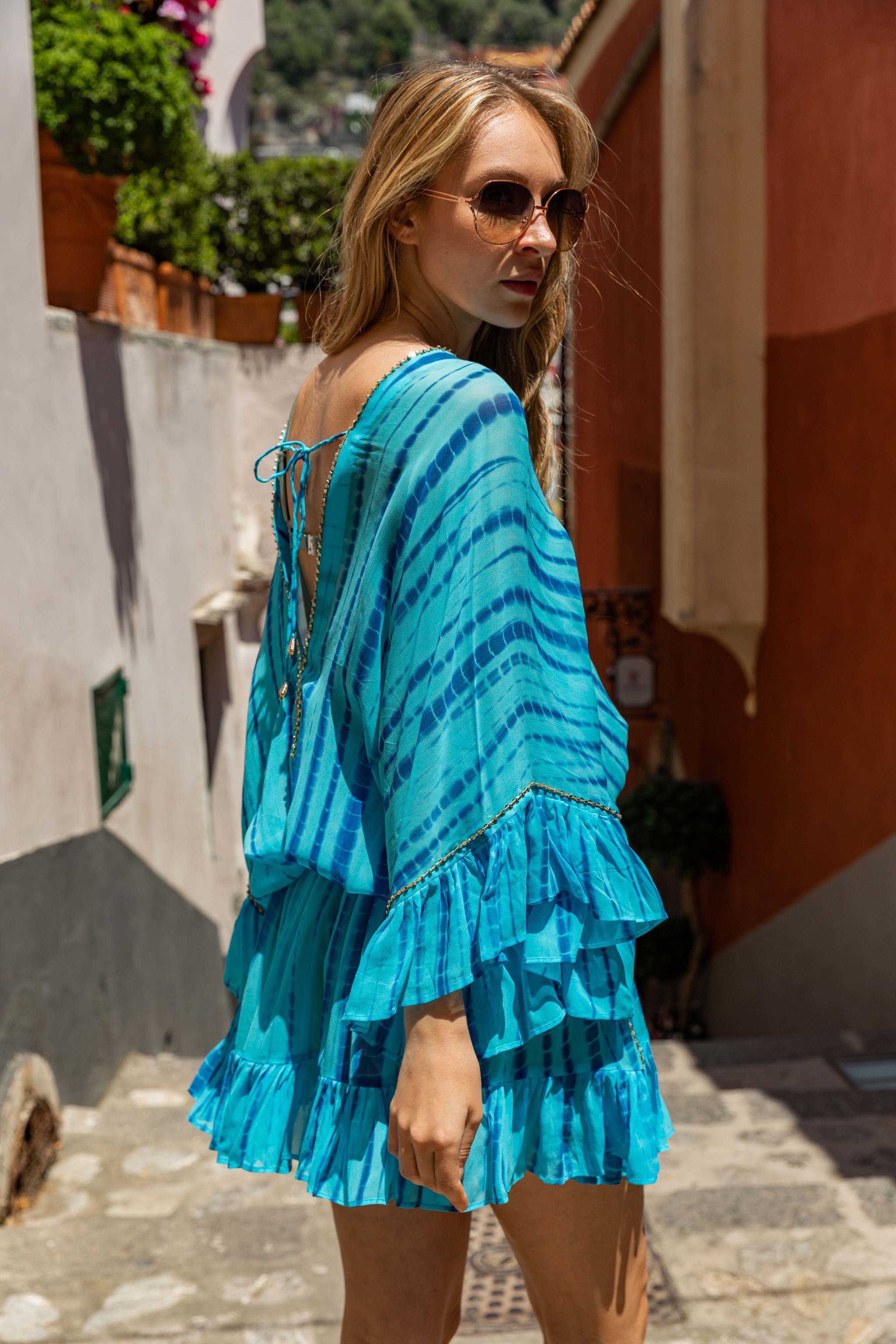 Turquoise and blue silk bloused beach dress to wear on holiday by Lindsey Brown luxury resort wear