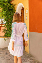 White cotton beach dress to wear on holiday by Lindsey Brown resort wear