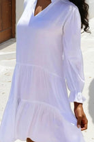 White cotton beach dress to wear on holiday by Lindsey Brown resort wear