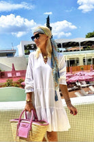 White cotton holiday dress with long sleeves by lindsey brown cotton resort wear 