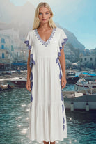 White and blue loose floaty cotton maxi dresses to wear on holiday by Lindsey Brown resort wear
