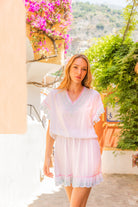 White drop waisted blouson beach dress to wear on holiday by Lindsey Brown resort wear 