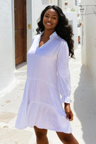 White knee length cotton beach dress by Lindsey Brown resort wear 