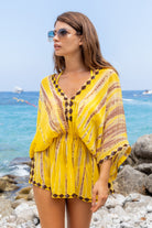 Yellow silk luxury kaftans to wear on holiday by Lindsey Brown glam beachwear