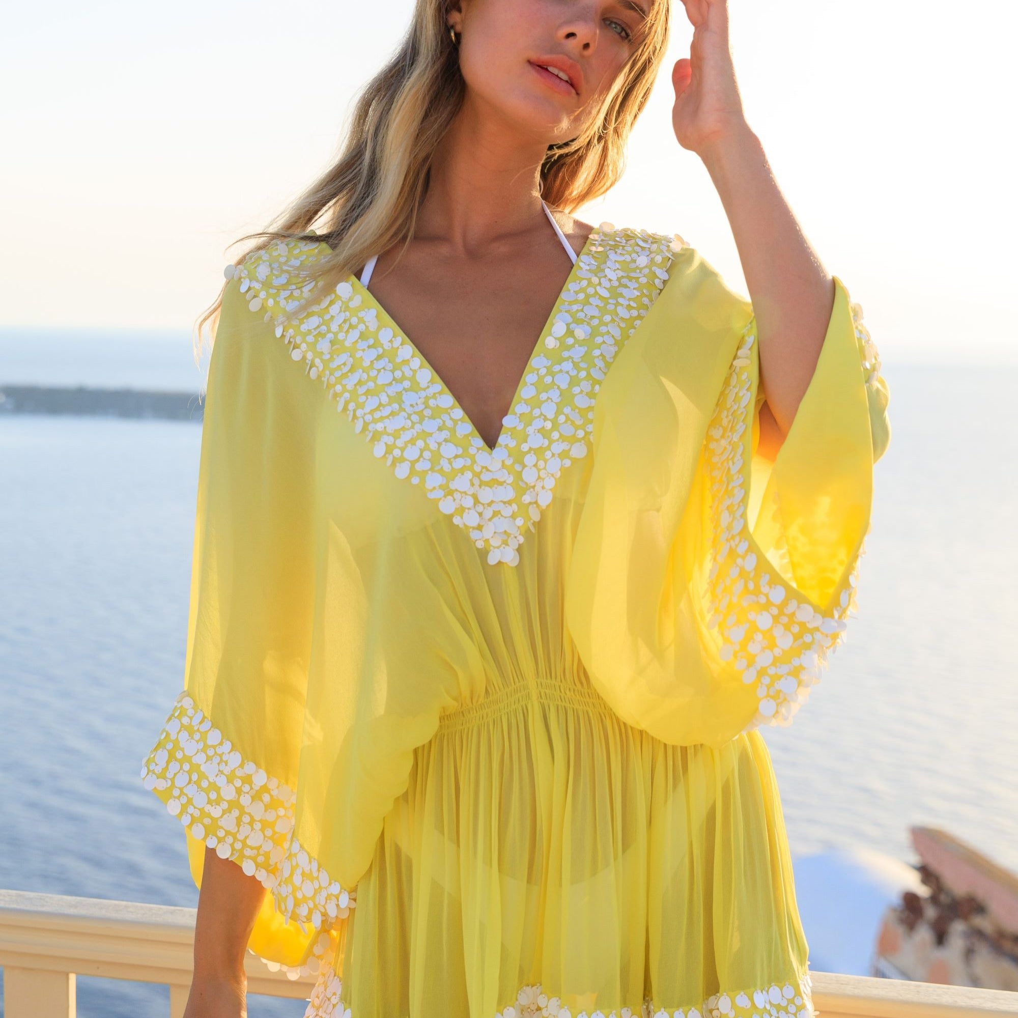 Yellow silk designer kaftans and a soft elasticated waistline that fits xsmall to large Beautifully hand crafted with white sequins by Lindsey Brown resort wear