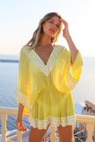 Yellow silk designer kaftans and a soft elasticated waistline that fits xsmall to large Beautifully hand crafted with white sequins by Lindsey Brown resort wear