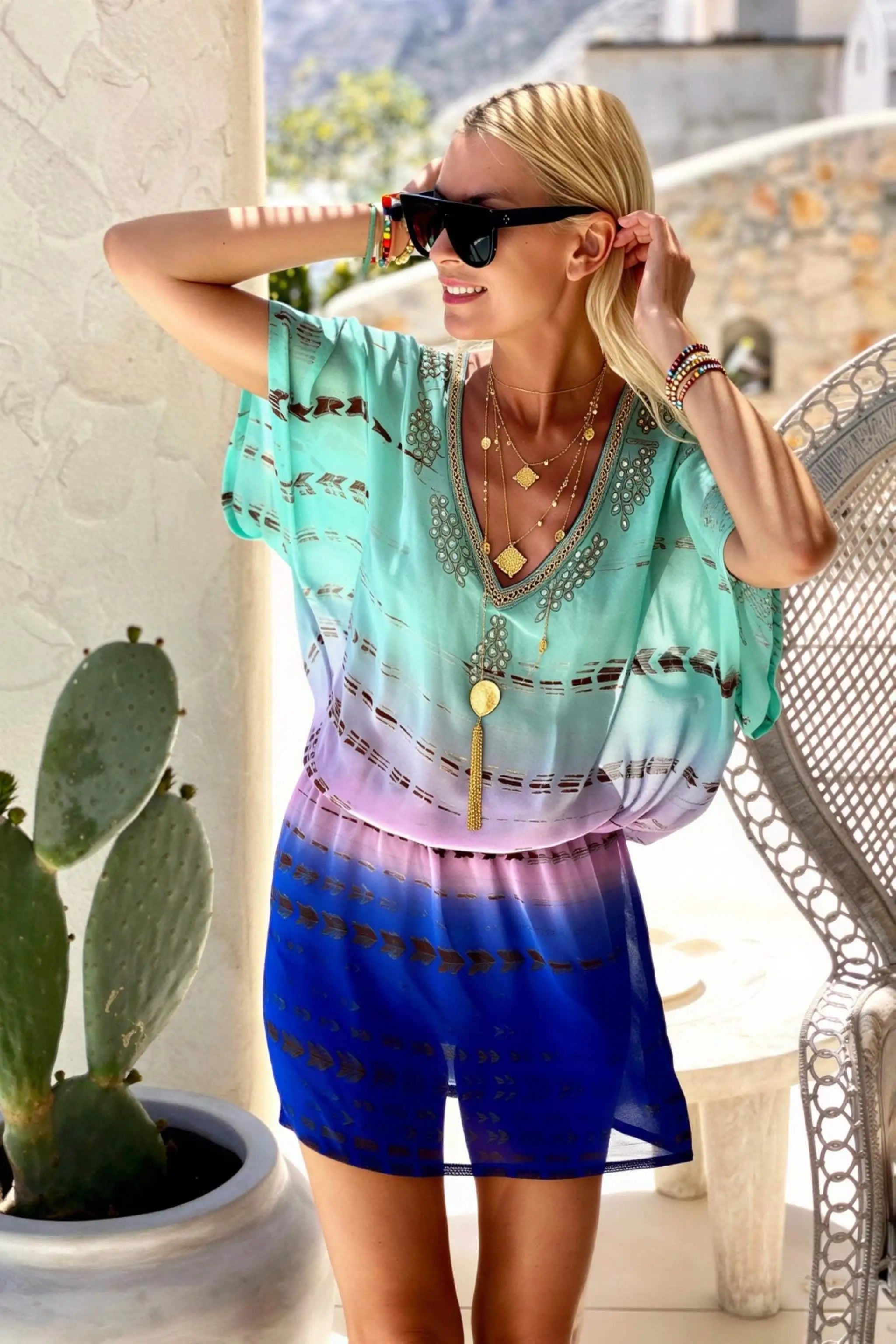 aqua silk kaftan dress to wear on a luxury holiday by lindsey brown resort wear 