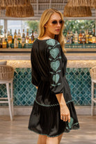 black cotton long sleeved beach dresses with aqua motifs on the sleeves for summer