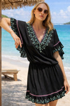 black cotton beach dress by lindsey brown to wear on a cruise holiday