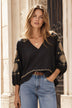 black cotton blouse with gold embroidery by Lindsey Brown resort wear 