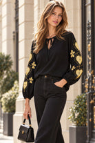 black cotton blouse with metallic gold heart embroidery by Lindsey Brown