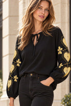 black cotton blouse with gold heart embroidery