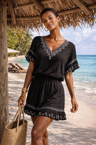 black cotton v neck beach dresses to wear on holiday by lindsey brown resort wear 