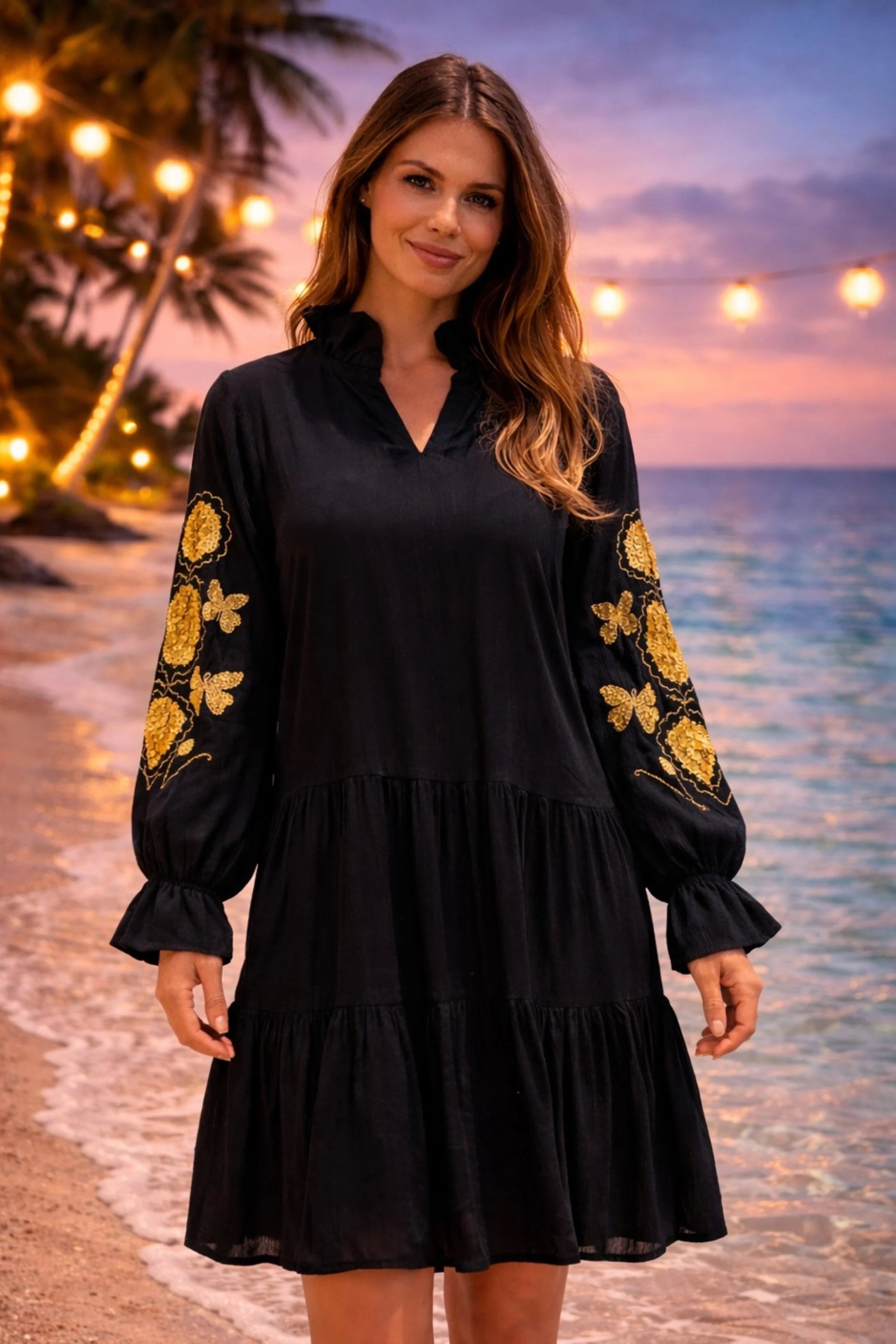 black long sleeved beach dress with gold embroidery on the sleeves