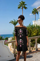 black strapless off the shoulder dress to wear on holiday by lindsey brown