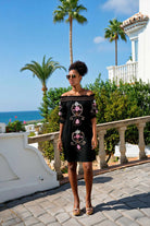 black off the shoulder dress to wear on holiday by lindsey brown