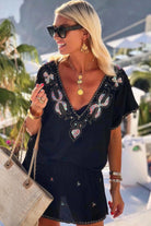 black bloused cotton v neck designer beach dress to wear on holiday by lindsey brown luxury cotton resort wear 