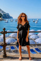 black v neck short sleeved designer beach dress to wear on holiday by lindsey brown cotton resort ear 