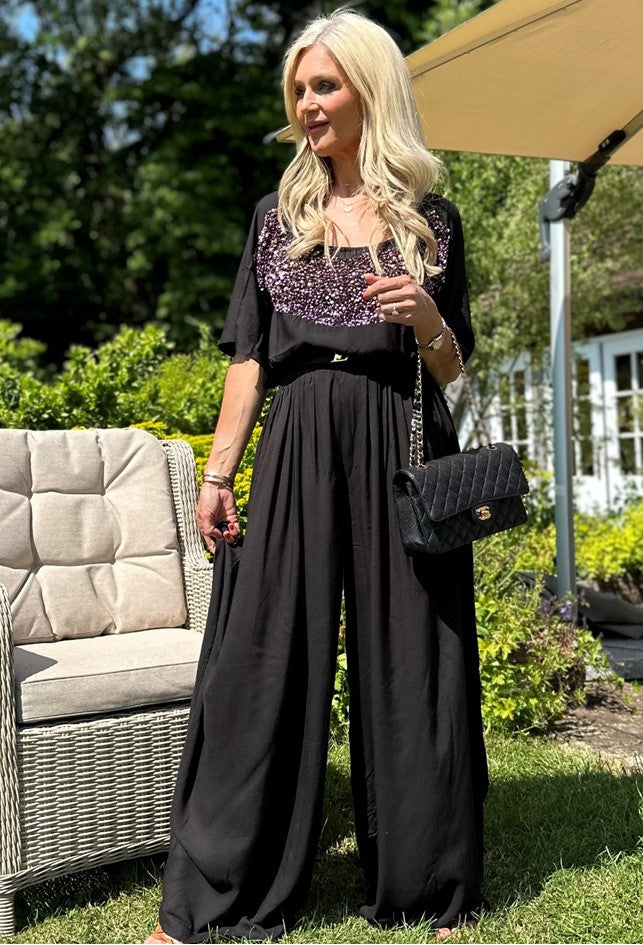 black wide leg trousers to wear on holiday by lindsey brown resort wear 