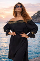 black and gold off the shoulder dress to wear on holiday by Lindsey Brown