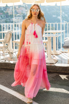 Walking view of Santorini pink silk chiffon maxi dress, by Lindsey Brown.