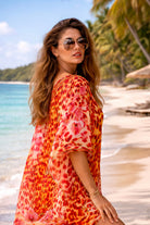 orange and red animal printed silk beach coverup to wear on a cruise holiday  by lindsey brown resort wear 