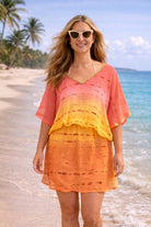 orange  pink yellow ombre silk designer kaftan to wear on a luxury holiday by lindsey brown silk resort wear 
