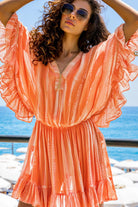 orange silk bloused designer kaftans to wear on holiday by Lindsey Brown resort wear 