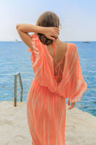 orange low back silk maxi kaftans to wear on vacation by Lindsey Brown luxury silk resort wear 