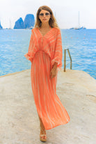 orange silk maxi kaftans to wear on vacation by Lindsey Brown resort wear 
