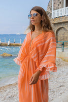orange silk luxury maxi kaftans to wear on vacation by Lindsey Brown resort wear 