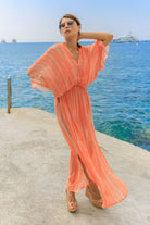 orange silk maxi kaftans to wear on holiday  by Lindsey Brown silk resort wear 