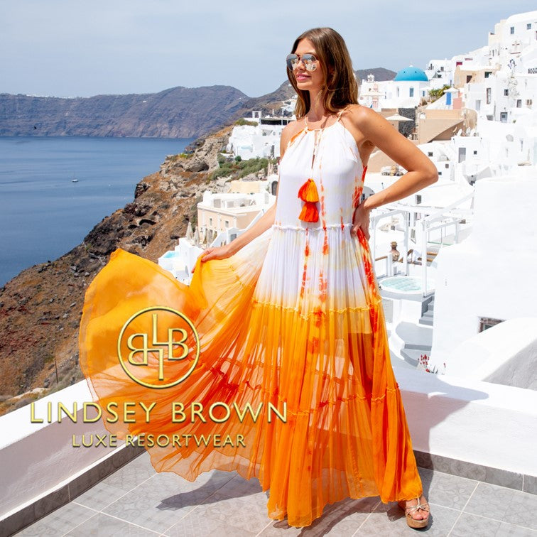 orange silk luxury resort wear maxi dresses to wear on holiday by Lindsey Brown resort wear