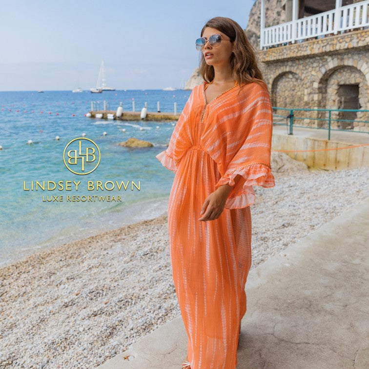 orange silk maxi kaftans to wear on holiday by Lindsey Brown resort wear
