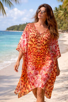 orange and red animal printed silk beach coverup to wear on a cruise