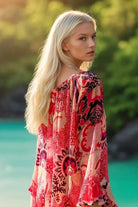 pink printed long sleeve resort wear dress by Lindsey Brown