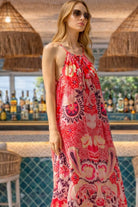 pink abstract printed maxi dress, effortlessly elegant and designed for sunshine-filled holidays.