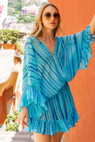 turquoise blue silk kaftan dresses to wear on holiday by Lindsey Brown resort wear