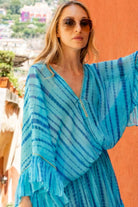 turquoise silk kaftan dresses to wear on vacation by Lindsey Brown resort wear