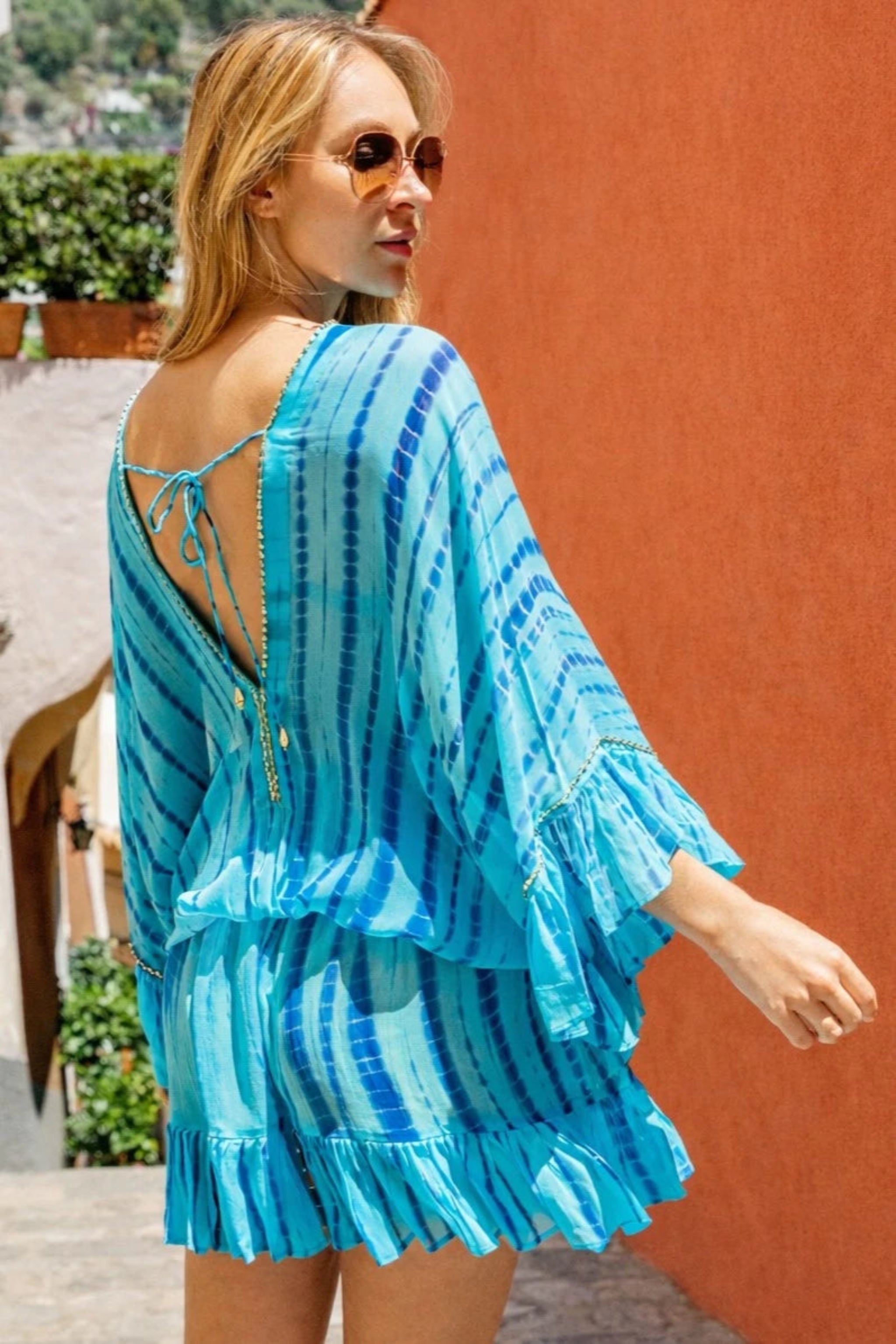turquoise blue silk kaftan dress to wear on holiday by Lindsey Brown resort wear