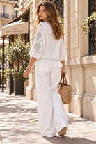 white cotton blouse with silver embroidery by Lindsey Brown