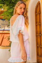 white cotton designer beach dress to wear on holiday by lindsey brown resort wear 
